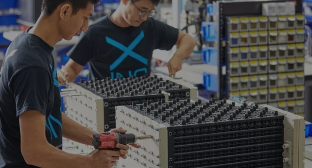 Workers assembling Immersi XE50 battery system