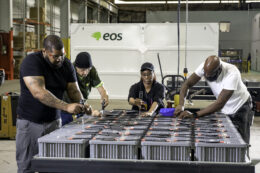 Workers assembling batteries