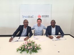 Three men signing the agreement