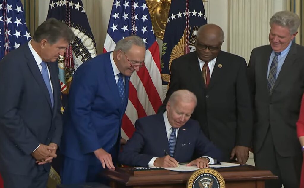 Joe Biden signs the Inflation Reduction Act of 2022.